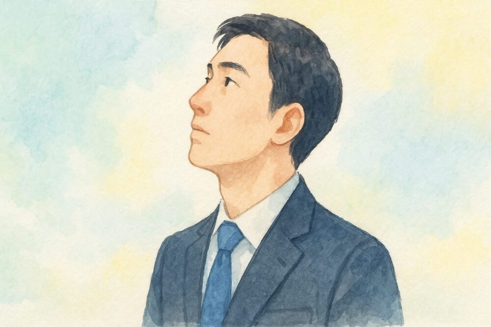 斜め上を向く男性