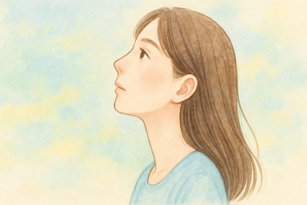 空を見上げる女性の横顔